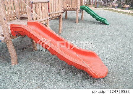 Enjoying Playground Slides in a Safe and FamilyFriendly Park Setting for Everyone Enjoying Playground Slides in a Safe and FamilyFriendly Park Setting for Everyone 124729558