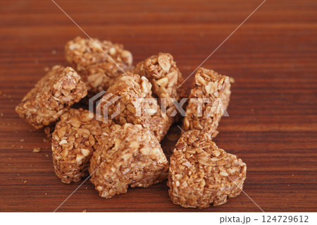 Granola squares arranged on a wooden surface for healthy snacking 124729612