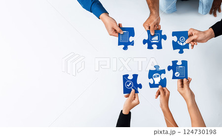 Collaborative Teamwork Symbolized by Puzzle Pieces with Icons Representing Growth, Strategy, Analysis, and Success in Business Settings. Amity 124730198
