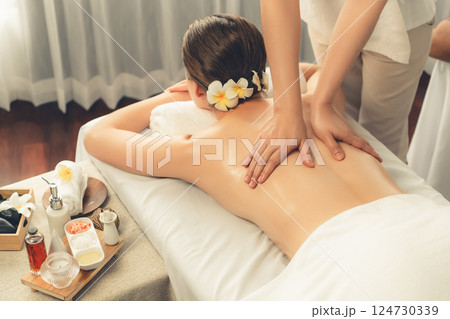 Caucasian woman customer enjoying relaxing anti-stress massage. Quiescent Caucasian woman customer enjoying relaxing anti-stress massage. Quiescent 124730339