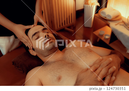 Caucasian man enjoying relaxing anti-stress head massage. Quiescent 124730351