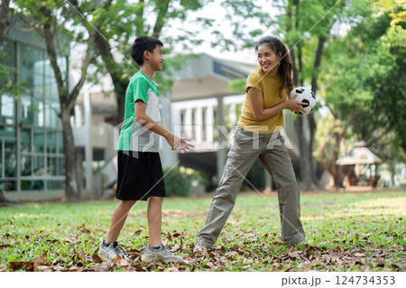 Healthy Play and Youth Empowerment. Children enjoying a soccer session, encouraging teamwork and fitness in an outdoor setting. 124734353