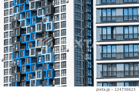 Building with modern design. Tall multistory condominium in metropolitan neighborhood, downtown Building with modern design. Tall multistory condominium in metropolitan neighborhood, downtown 124736623