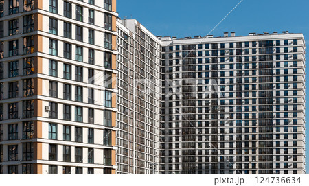 Building with modern architecture. Tall condominium block with window facade in urban neighborhood, Building with modern architecture. Tall condominium block with window facade in urban neighborhood, 124736634