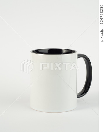 Two-tone 11oz mug on isolated background. Mug with black handle and inner part. Two-tone 11oz mug on isolated background. Mug with black handle and inner part. 124738259