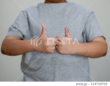 Child's hand thumb up is a symbol 124739729