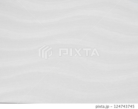 Subtle white waves on a textured paper surface with an organic flow 124743745
