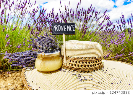 Summer hat and honey at lavender field, Provence France. Summer hat and honey at lavender field, Provence France. 124743858