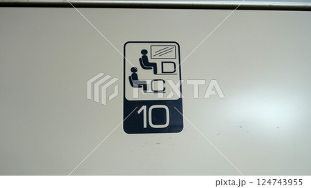 Directions for a numbered seat in a train compartment. 124743955