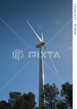 Wind turbine with blue sky at background Wind turbine with blue sky at background 124744353