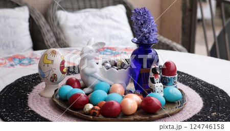 Colorful Easter eggs and creative decorating techniques for an impressive centerpiece featuring beautifully colored eggs for the holiday celebration Colorful Easter eggs and creative decorating techniques for an impressive centerpiece featuring beautifully colored eggs for the holiday celebration 124746158