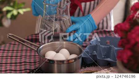 Preparing Easter eggs for coloring, boiling eggs for decoration and family fun during the holiday season 124746196