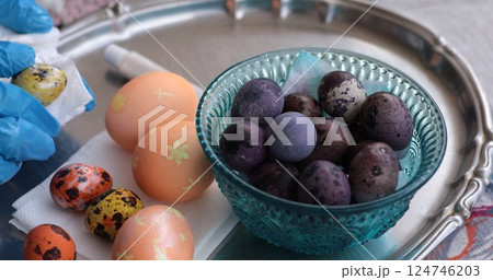 Vibrant Easter eggs and quail eggs adorned with pearl paint ready for celebration Vibrant Easter eggs and quail eggs adorned with pearl paint ready for celebration 124746203