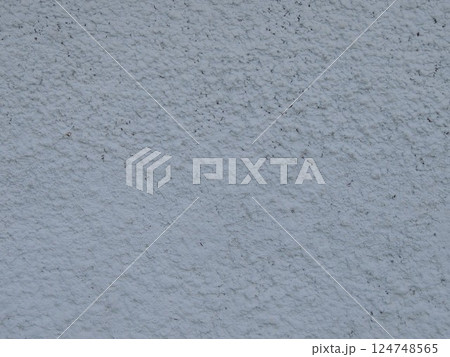 plastered wall surface with frozen textured streaks and dust in texture folds, abstract light gray background with lip relief, fragment of rough plaster full frame close-up 124748565