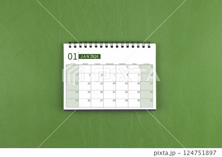 January 2026 Monthly desk calendar on green leather background. January 2026 Monthly desk calendar on green leather background. 124751897