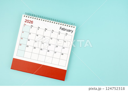 February 2026 desk calendar on blue background for your appointment. 124752318