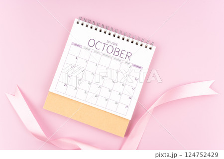 October 2026 desk calendar with pink pastel ribbon. October 2026 desk calendar with pink pastel ribbon. 124752429