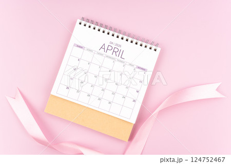 April 2026 desk calendar with pink pastel ribbon. April 2026 desk calendar with pink pastel ribbon. 124752467