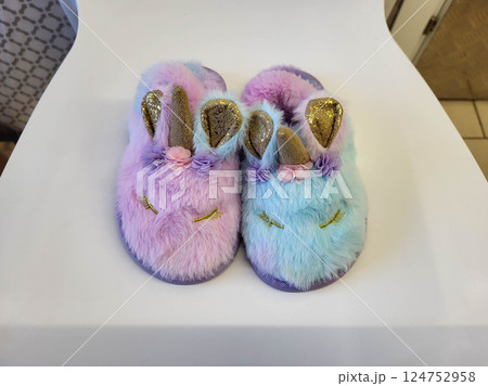 Cute Fluffy Colorful Baby Slippers with Unicorn Horn and Ears. 124752958