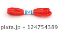 Red thread bracelet isolated on white. 124754389