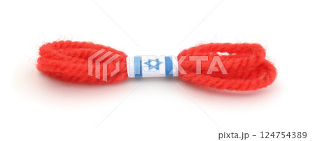 Red thread bracelet isolated on white. Red thread bracelet isolated on white. 124754389