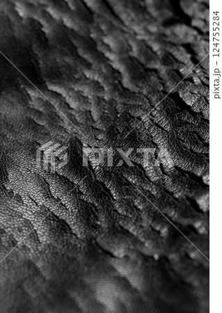 Black eco-leather with cracks. Macro photography. 124755284