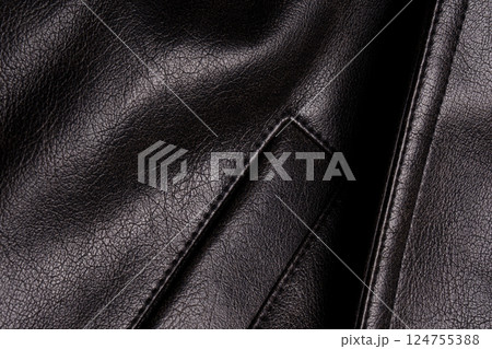 A sample of black leather fabric. Seams and pocket. Macro photo. A sample of black leather fabric. Seams and pocket. Macro photo. 124755388