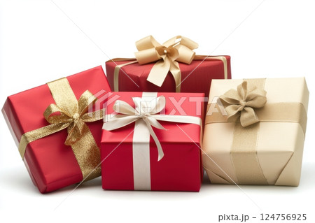 elegant holiday gift set with three beautifully wrapped presents in red and gold, adorned with luxurious ribbons and carefully tied bows, rich textured paper, festive celebration mood 124756925