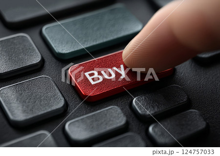 Finger presses buy button on computer keyboard 124757033