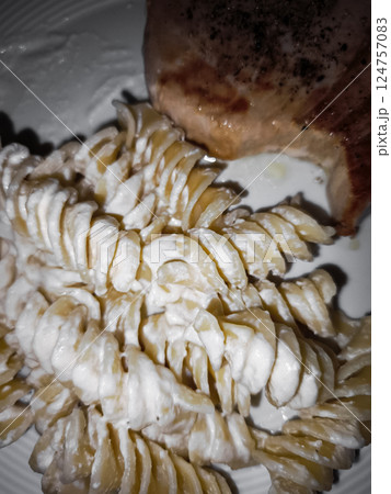 Delicious tuna steak and creamy pasta creating a tasty meal dinner Delicious tuna steak and creamy pasta creating a tasty meal dinner 124757083