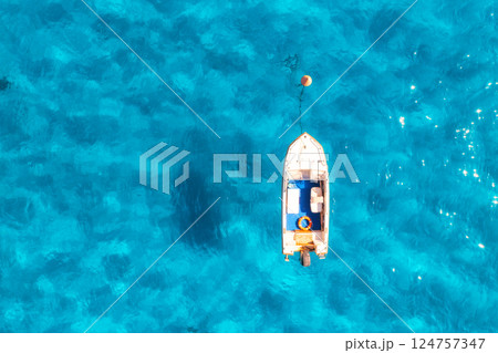 Aerial view of boat in blue sea in summer at sunset 124757347