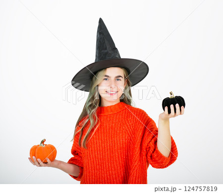 Portrait smiling girl in witch black hat, with pumpkin jack sweet candy. Isolated white background Portrait smiling girl in witch black hat, with pumpkin jack sweet candy. Isolated white background 124757819