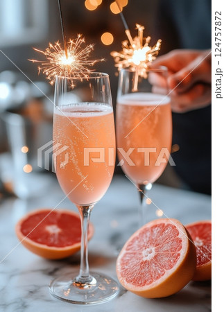 Sparkling Drinks With Festive Sparklers and Fresh Fruit on a Table 124757872