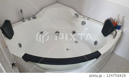 Jacuzzi bathtub interior in bathroom Jacuzzi bathtub interior in bathroom 124758428