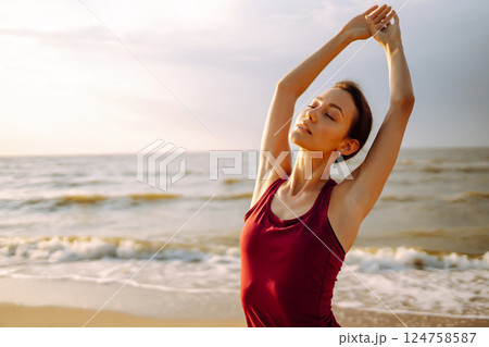 Sport woman doing exercises outdoors. Woman doing stretching. Sport, Active life, healthy lifestyle. 124758587