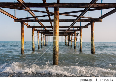 Under the abandoned rusty pier. Under the abandoned rusty pier. 124759013