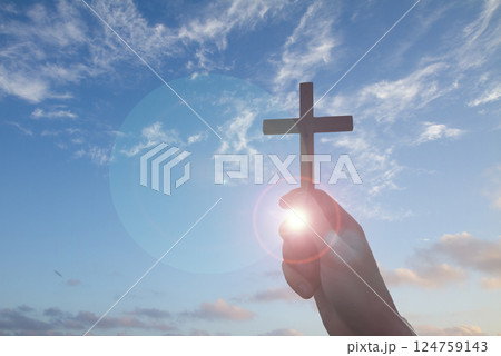 Christian prayer. Man on his knees praying on sunset background. Kneeling prayer to God. 124759143