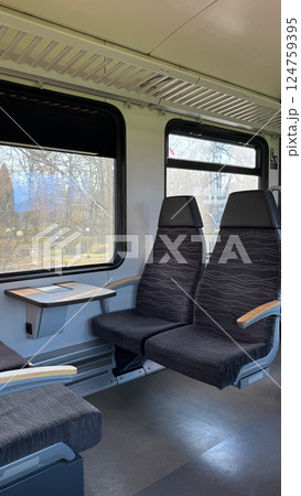 Interior of Empty Train Cabin with Large Windows and Comfortable Seats 124759395