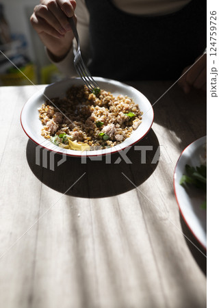 A Flavorful and Delicious Homemade Dish Beautifully Served on a Rustic Wooden Table 124759726