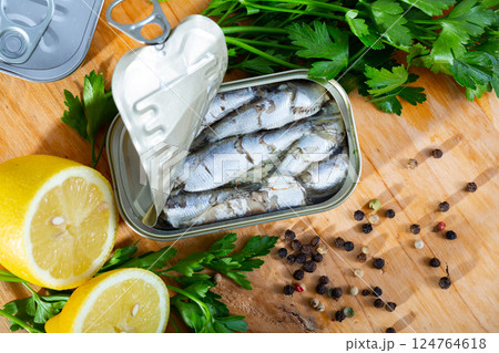 Tin can with smoked sprats, sardines, closeup 124764618