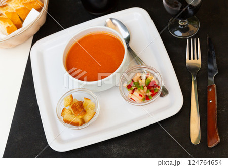 Andalusian vegetable soup puree gazpacho with croutons and vegetables Andalusian vegetable soup puree gazpacho with croutons and vegetables 124764654