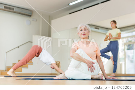 Senior woman exercising stretching workout 124765209