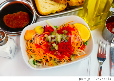 Seasonal vegetable salad with carrot and cucumber Seasonal vegetable salad with carrot and cucumber 124765213