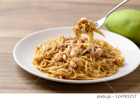 Spicy mango salad ready to eating, Thai food Spicy mango salad ready to eating, Thai food 124765257