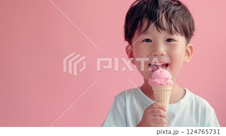 Little boy eating vanilla ice cream dessert in summer copy space isolated pink background 124765731