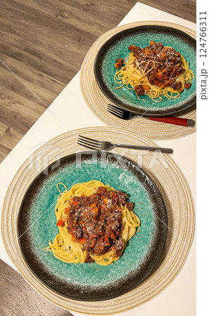 Spaghetti with bolognese sauce served on a plate. Italian cuisine Spaghetti with bolognese sauce served on a plate. Italian cuisine 124766311