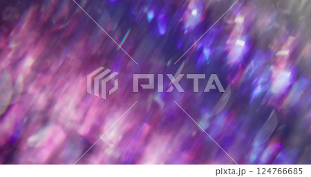 Lens glimmer. Defocused sparkle kaleidoscope. Purple blue color blinking liquid twirling on blurred abstract bokeh light background. Lens glimmer. Defocused sparkle kaleidoscope. Purple blue color blinking liquid twirling on blurred abstract bokeh light background. 124766685