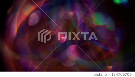 Defocused round glow. Mix light flares. Sparkling purple color particles lens flash motion on blurred background with bokeh effect. 124766709