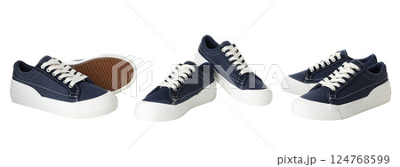 Stylish casual navy shoes are neatly arranged for a clear view, isolated on white Stylish casual navy shoes are neatly arranged for a clear view, isolated on white 124768599
