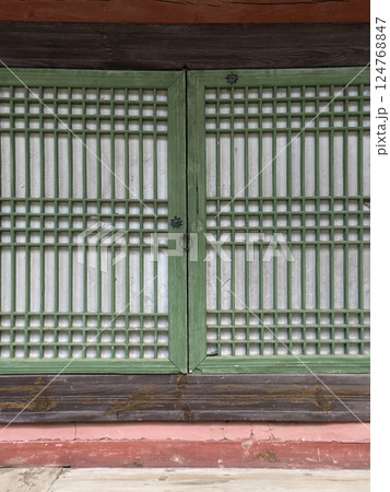 The quiet shadows and natural textures of hanok invite you into a space of peace and nostalgia. 124768847